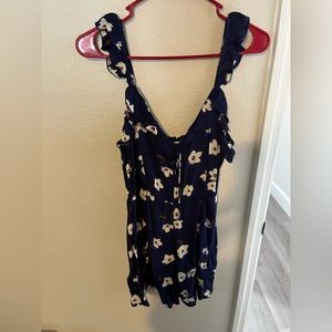 Billabong size small romper, dark blue with flowers